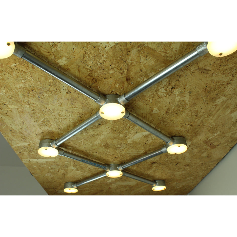 Conduit light fixture with illuminated dots